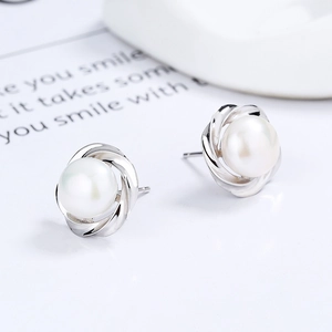 Elegant 925 sterling silver pearl stud earrings featuring a dynamic twisted metal design