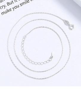Detail of 925 sterling silver bamboo chain with adjustable clasp and teardrop pendant