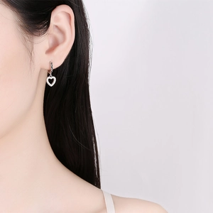 925 Sterling Silver Heart Hoop Earrings with zircon pavé detail on female model