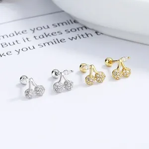 Macro detail of cherry earrings with micro-pave zircons and secure screw-back design