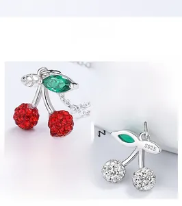 Detailed view of S925 sterling silver cherry pendant with red and white crystal inlay
