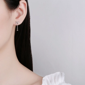 925 silver bow tassel earrings with dangling chain and bead for a minimalist chic look
