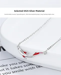Detail of S925 silver koi fish necklace featuring pink enamel and white zircon stones