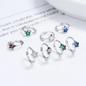 Detailed macro view of S925 silver star earrings with colorful zircon stones