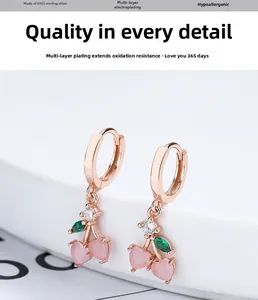 Detailed view of S925 sterling silver cherry earrings with pink heart shaped stones