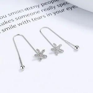 Macro shot of 925 sterling silver flower tassel earrings with sparkling zircon inlay