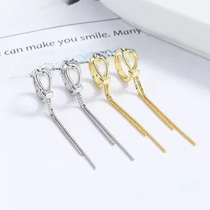 Detail of 925 sterling silver tassel drop earrings in silver and gold finishes