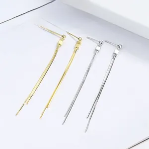 Detail view of 925 silver butterfly tassel threader earrings in gold and silver finish