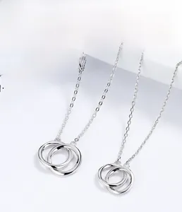 Macro shot of 925 sterling silver interlocking double ring necklace with polished finish