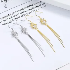 Detail of 925 silver flower tassel earrings with heart zircon and crown design in gold and silver