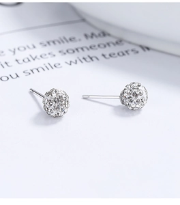 Detailed close-up of sparkling 925 silver disco ball earrings with clear crystals