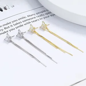 Detail of 925 sterling silver butterfly tassel earrings with marquise cubic zirconia