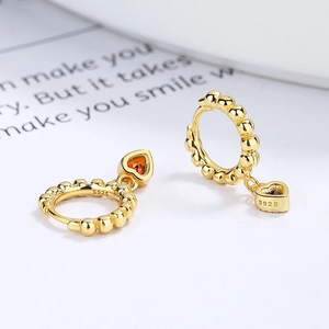 925 silver heart hoop earrings with gold plating and orange gemstones in 45-degree view