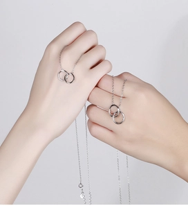 Detailed view of 925 sterling silver Mobius double ring necklace with lobster clasp