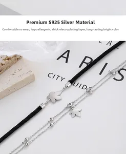 Detailed close-up of S925 sterling silver maple leaf pendant on a woven couple bracelet