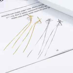 Detail of 925 silver fringe tassel earrings with X-shape rhinestone studs in gold and silver