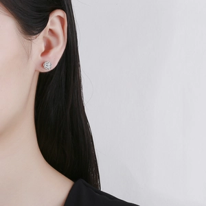 Sterling silver Shamballa stud earrings with sparkling pavé crystals on female model