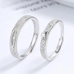 Detail of 925 sterling silver couple rings with frosted finish and adjustable band