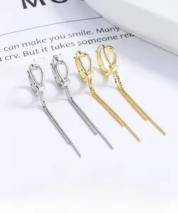 Macro shot of 925 sterling silver long tassel earrings with delicate box chains and round loops