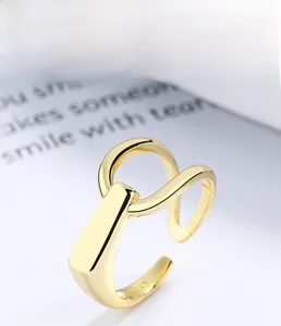 Macro shot of 925 sterling silver ring featuring 18K gold plating and adjustable band