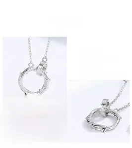 Macro detail of S925 sterling silver necklace featuring interlocking textured rings