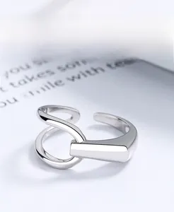 Macro shot of S925 sterling silver ring with interlocking geometric design and polished finish