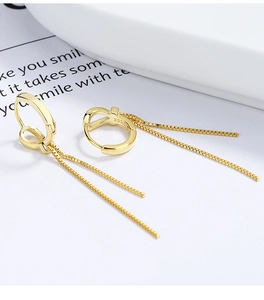 Detail of S925 sterling silver stamp on gold knot tassel earrings with long box chains