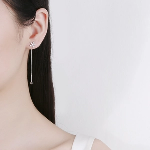 925 Sterling Silver flower tassel earrings with zircons shown on a model side profile