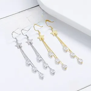 Detail of 925 silver star tassel earrings with zircon waterdrop pendants in gold and silver