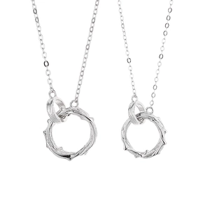 925 Sterling silver interlocking rings necklace with thorn texture on white background