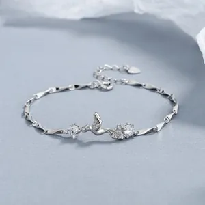 Detail of 925 silver tulip bracelet with leaf design, zircon stones and heart tag