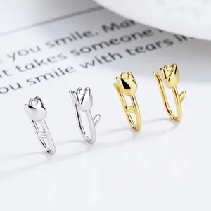 Detailed close-up of 925 silver and gold tulip hoop earrings with enamel flower petals
