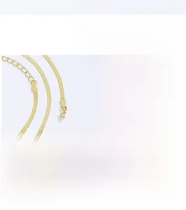 Detail of 925 sterling silver flat snake chain necklace with gold plating and S925 hallmark