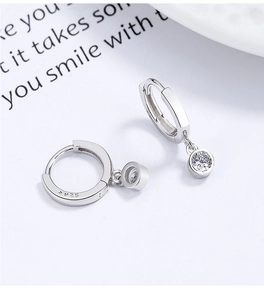 Macro shot of S925 sterling silver hoop earring with sparkling round zircon and hallmark