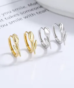 Detail showing elegant gold and silver 925 sterling silver tulip hoop earrings