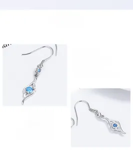Detailed macro view of S925 sterling silver earring featuring blue zircon and S925 hallmark