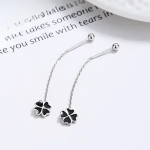 Detail of 925 sterling silver earring threads with black clover pendant and hallmark