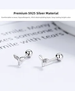 Macro shot of S925 sterling silver whale tail earrings with shimmering micro diamonds