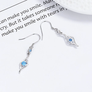 Elegant 925 sterling silver drop earrings with blue zircon in a streamlined swirl design