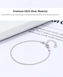 Detail of 925 sterling silver flat snake chain bracelet with heart charm and lobster clasp