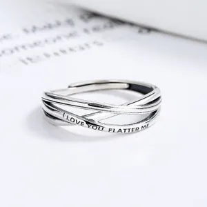 Close-up of S925 sterling silver X-shaped ring with I LOVE YOU FLATTER ME engraving