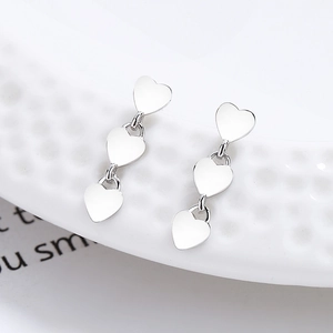 Triple heart drop earrings in 925 sterling silver with polished finish for women