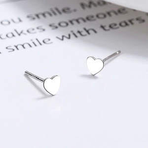 925 Sterling Silver triple black heart stud earrings on elegant white paper background
