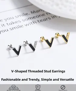 Detail of V-shaped S925 sterling silver earrings with black enamel and screw back design