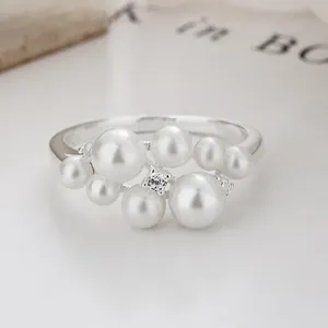 Detail of 925 sterling silver ring with cluster pearls and zircon accents