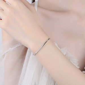 Minimalist 925 sterling silver square snake chain bracelet worn on a female wrist