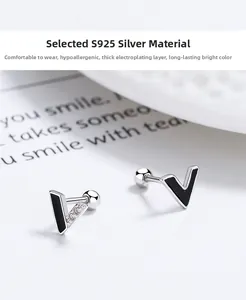 Detailed view of S925 silver V-shaped earrings with black enamel and zircon stones