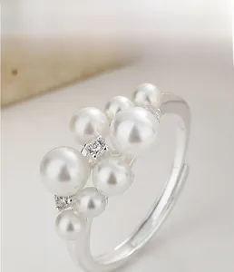Close-up of S925 sterling silver ring featuring multiple pearls and cubic zirconia stones