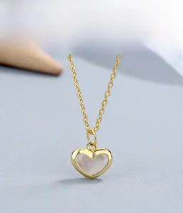 Detailed close-up of 925 sterling silver heart necklace with white mother of pearl inlay