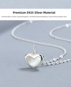 Detailed macro view of S925 silver heart necklace with white mother of pearl inlay